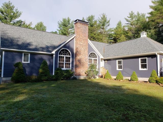 Blue Cape with a brick chimney by Jewell Painting