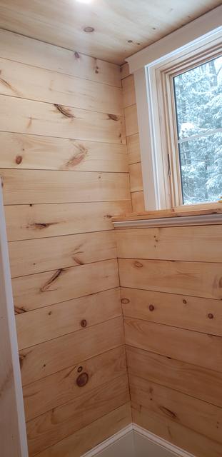 Knotty pine walls and window trim by Jewell Painting