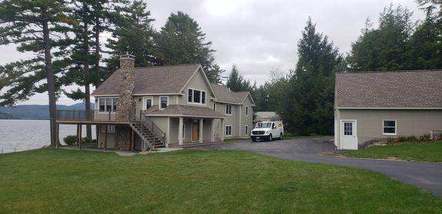 Lakefront home and garage by Jewell Painting