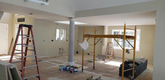 Open living space, prep and paint in progress by Jewell Painting