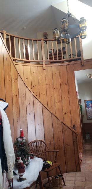Pine-paneled stairwell by Jewell Painting