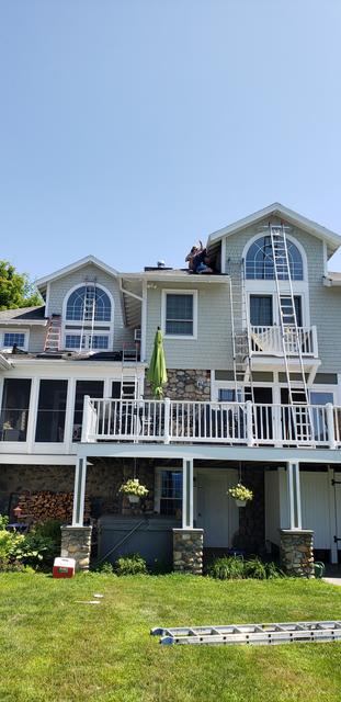 Three-story home, exterior in progress by Jewell Painting