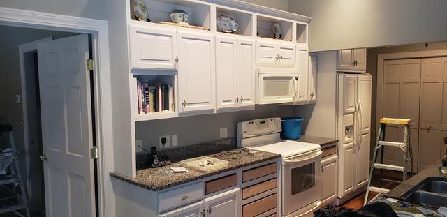 White kitchen cabinets and trim by Jewell Painting